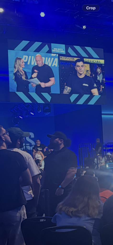 Dana White interviewing a DWCS fighter through the jumbotron broadcast setup rather than in person